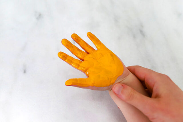 Paint hand orange