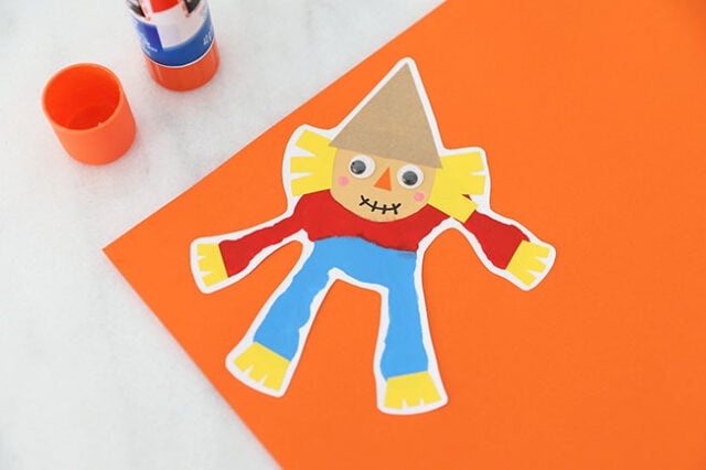 Scarecrow glued onto paper