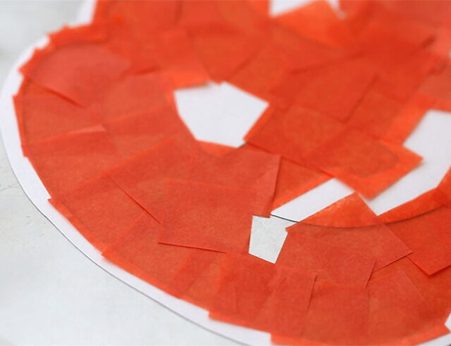 Add tissue paper to pumpkin