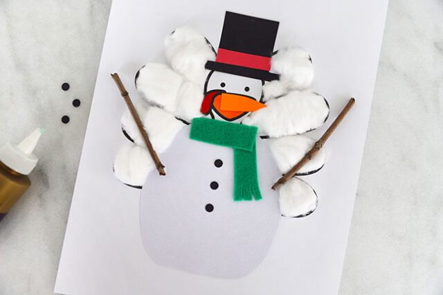 Buttons glued onto snowman