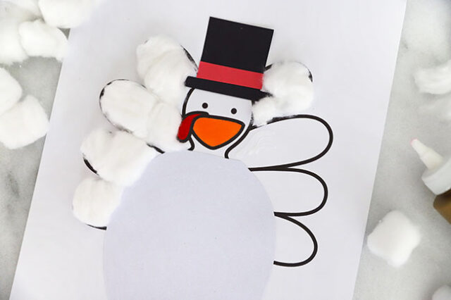 Cottonballs onto snowman tail feathers