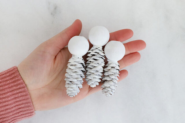 Snowmen pine cones painted