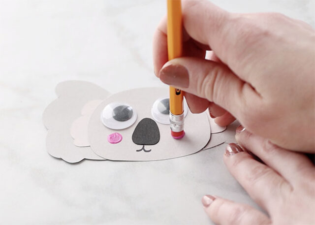 Stamping cheeks onto koala